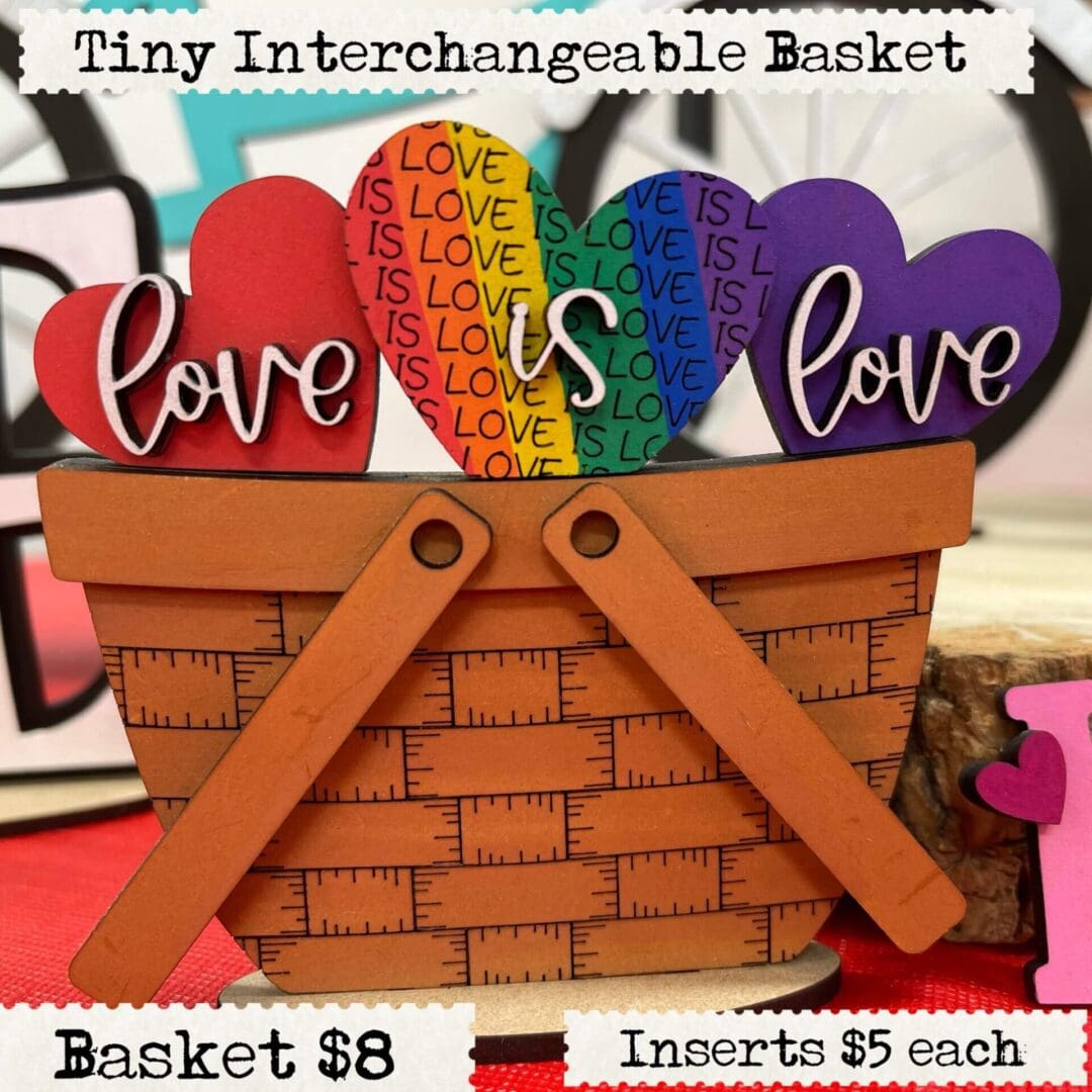 A basket with hearts and the words " love is love ".