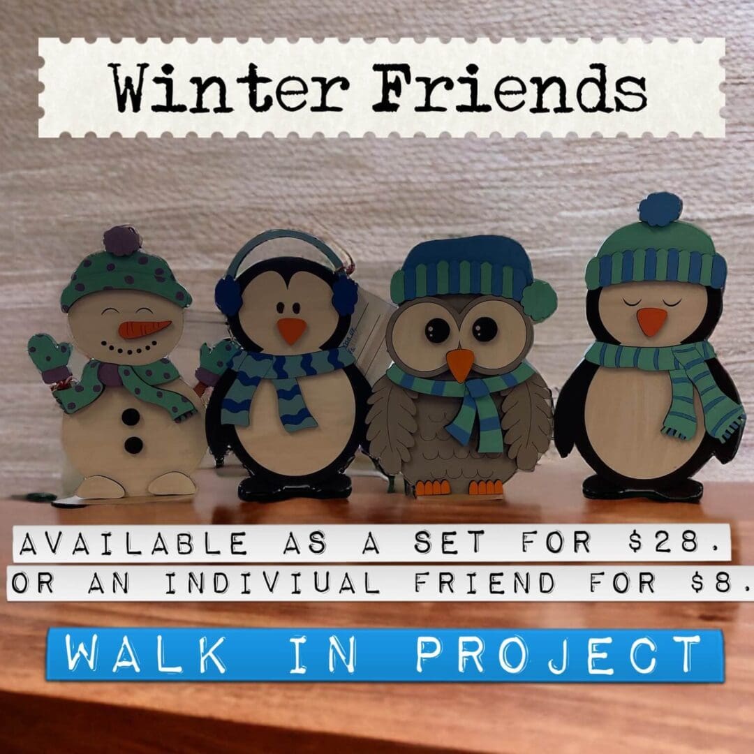 A wooden penguin and snowman set with the words " winter friends " on it.