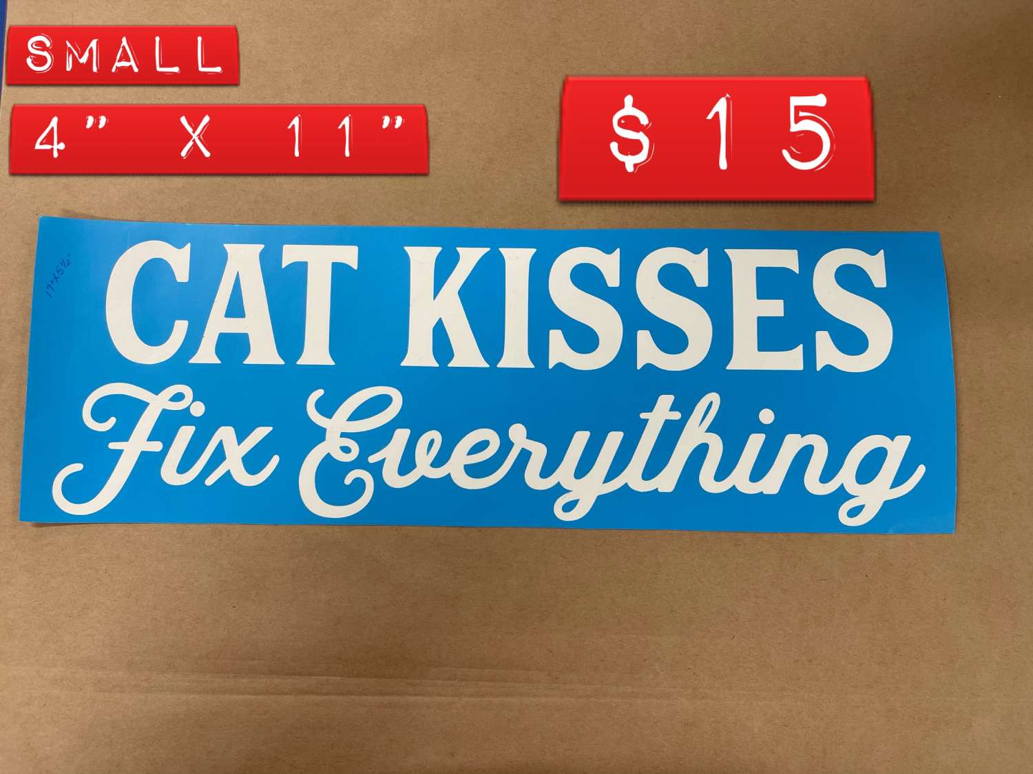 A sign that says " cat kisses fix everything ".