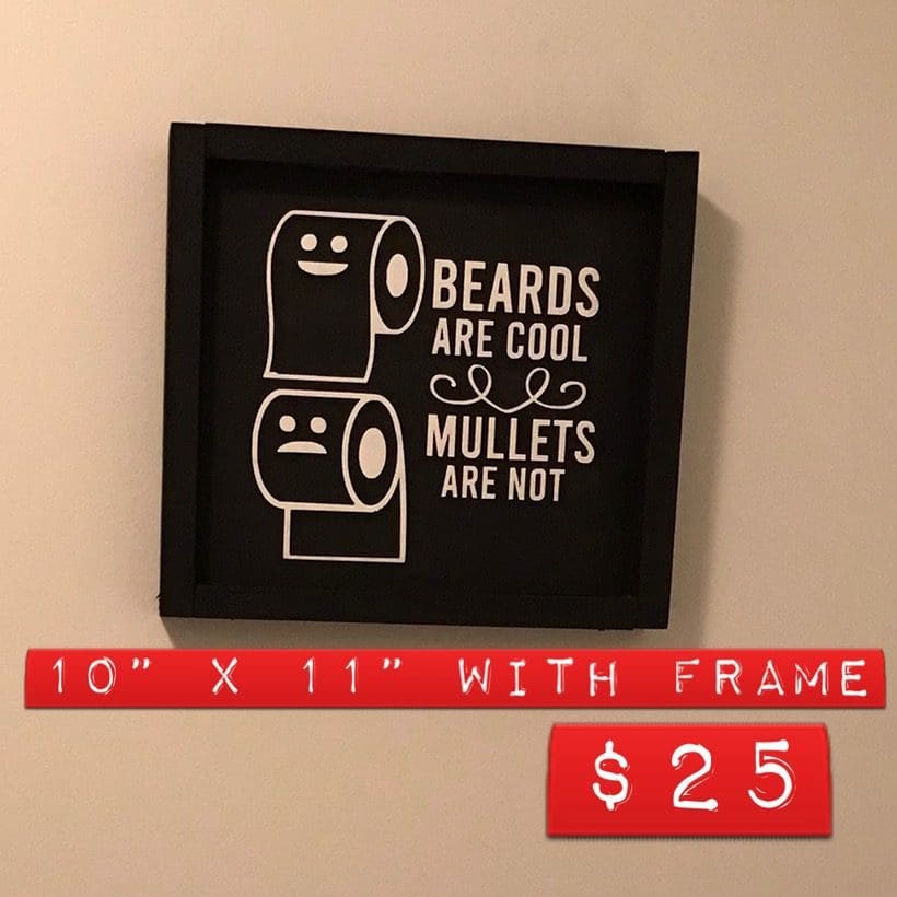 A framed picture of two toilet paper rolls.