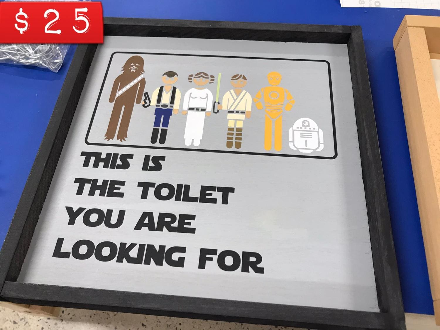 A sign with star wars characters on it